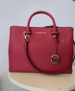 Beautiful magenta Michael Kors leather bag with gold trim