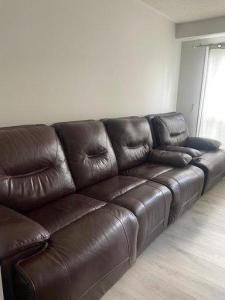 Reclining leather sofa